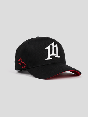INTRA ONE's black 5 panel cap with 111 angel number logo symbol on it, with 2 small embroidered hearts and a red underbrim